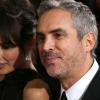Alfonso Cuarón et sa compagne Sheherazade Goldsmith à la 86e cérémonie des Oscars, à Los Angeles le 2 mars 2014.
