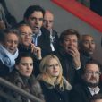 Richard Anconina, Gilles Bouleau et Laurent Delahousse lors du match entre le Paris Saint-Germain et le Bayer Leverkusen, huitième de finale retour de la Ligue des Champions au Parc des Princes à Paris le 12 mars 2014