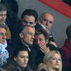 Gilles Bouleau et Laurent Delahousse lors du match entre le Paris Saint-Germain et le Bayer Leverkusen, huitième de finale retour de la Ligue des Champions au Parc des Princes à Paris le 12 mars 2014