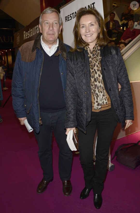 Richard et Cécilia Attias dans les allées de la 34e édition du Salon du livre, Porte de Versailles à Paris le 23 mars 2014.