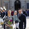 La princesse héritière Victoria de Suède, le prince Daniel et leur fille, la princesse Estelle, lors de la cérémonie organisée à l'occasion du jour de la Sainte Victoria dans la cour intérieur du palais royal à Stockholm, le 12 mars 2014.