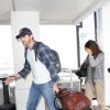 Ashton Kutcher et Mila Kunis arrivant à Los Angeles le 19 avril 2014