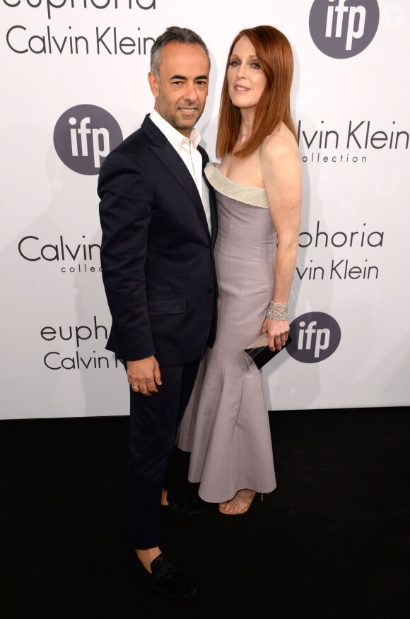 Francisco Costa et Julianne Moore assistent à la soirée Calvin Klein, donnée à l'occasion du 67e festival de Cannes. Cannes, le 15 mai 2014.