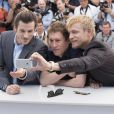 Gaspard Ulliel, Bertrand Bonello, Jérémie Renier - Photocall du film "Saint Laurent" lors du 67e festival international du film de Cannes, le 17 mai 2014.