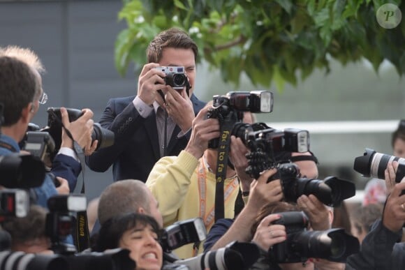 Channing Tatum prend des photos pendant le photocall de Foxcatcher au 67e Festival de Cannes, le 19 mai 2014.