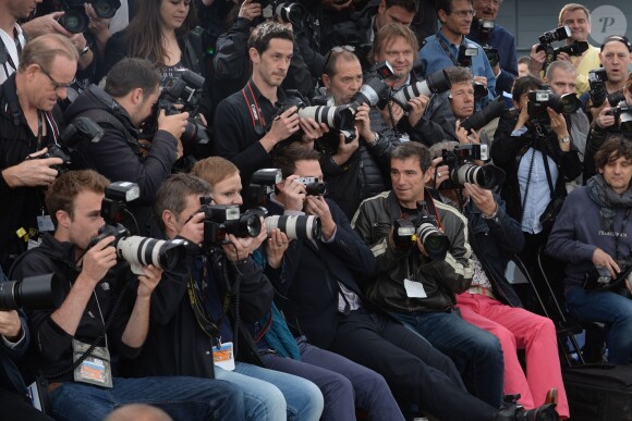 Channing Tatum prend des photos pendant le photocall de Foxcatcher au 67e Festival de Cannes, le 19 mai 2014.