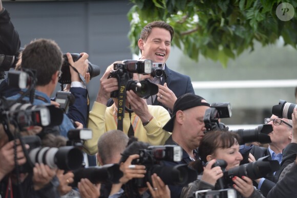 Channing Tatum prend des photos pendant le photocall de Foxcatcher au 67e Festival de Cannes, le 19 mai 2014.