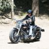 Johnny Hallyday conduit sa Harley Davidson à Los Angeles le 18 mai 2014. Johnny est de retour a LA, après sa tournée aux US, il est parti sur les routes de Malibu en moto pour rejoindre sa femme et ses filles au Calamigos Ranch.