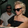 Pamela Anderson, arrive avec son mari Rick Salomon à l'aéroport de Nice pour le festival de Cannes. Le 13 mai 2014.