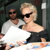 Pamela Anderson arrive avec son mari Rick Salomon à l'aéroport de Nice pour le festival de Cannes. Le 13 mai 2014.