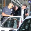 Le journaliste ukrainien Vitalii Sediuk, arrêté et menotté par les policiers sur le tapis rouge de "Maleficent" après avoir agressé Brad Pitt à Los Angeles le 28 mai 2014.