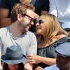 Marilou Berry et son compagnon Arnaud Schneider assistent au match entre Rafael Nadal et Leonardo Mayer aux Internationaux de France de tennis de Roland Garros à Paris, le 31 mai 2014.