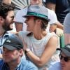 Julie de Bona et son compagnon - People aux Internationaux de France de tennis de Roland Garros à Paris, le 31 mai  2014.