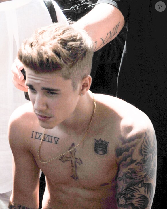 Justin Bieber, torse nu, se promène sur la Croisette lors du 67ème festival international du film de Cannes. Le 20 mai 2014.