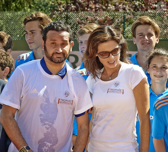 Cyril Hanouna et Caroline Barclay, à Roland-Garros pour participer au Trophée des personnalités, le vendredi 6 juin 2014.