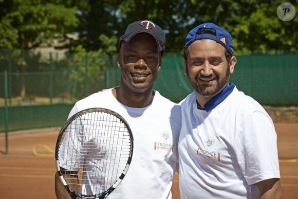 Sylvain Wiltord et Cyril Hanouna à Roland-Garros pour participer au Trophée des personnalités, le vendredi 6 juin 2014.