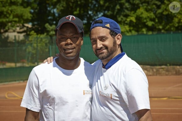 Cyril Hanouna et Sylvain Wiltord à Roland-Garros pour participer au Trophée des personnalités, le vendredi 6 juin 2014.
