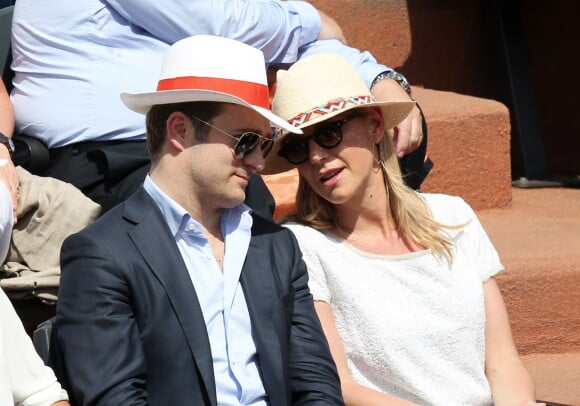 Laurence Ferrari et son mari Renaud Capuçon assistent à la finale dame des Internationaux de France de tennis de Roland Garros à Paris le 7 juin 2014