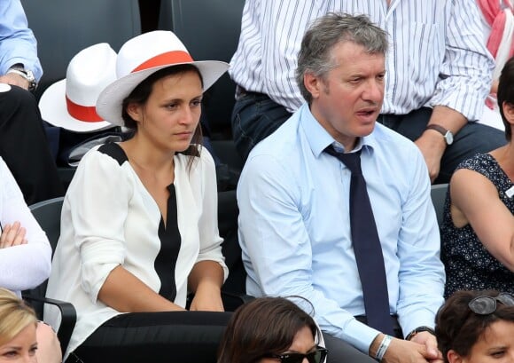 Thierry Rey et sa compagne assistent à la finale dame des Internationaux de France de tennis de Roland Garros à Paris le 7 juin 2014