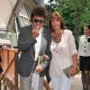 Robert Charlebois et sa femme Laurence au village des Internationaux de France de tennis de Roland Garros à Paris, le 7 juin 2014