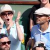 Audrey Fleurot et son nouveau compagnon Djibril Glissant assistent à la finale dame lors des Internationaux de France de tennis de Roland Garros à Paris le 7 juin 2014