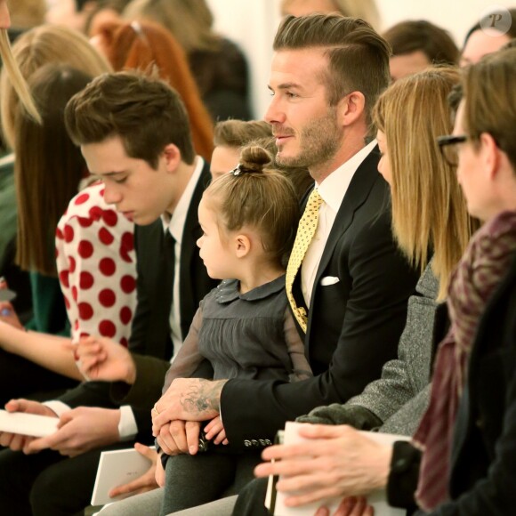 David Beckham et ses enfants Brooklyn, Romeo, Cruz et Harper assistent au défilé de Victoria Beckham, collection prêt-à-porter automne 2014 à New York, le 9 février 2014.