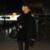 Gisele Bündchen, tout de noir vêtue et chaussée de bottines Isabel Marant à l'aéroport Roissy- Charles de Gaulle. Le 27 février 2014.