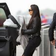 Kim Kardashian et sa fille North West arrivent à l'aéroport de New York, le 25 juin 2014.