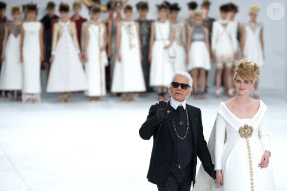 Designer Karl Lagerfeld walks the runway with a model for the Chanel collection presentation as part of the Haute-Couture Fall-Winter 2014-2015 fashion week, at the Grand Palais in Paris, France, on July 8, 2014. Photo Thierry Orban/ABACAPRESS.COM08/07/2014 - Paris