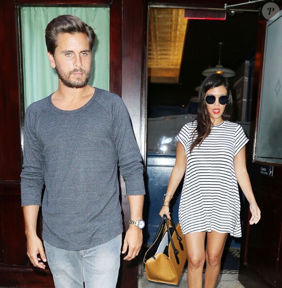 Kourtney Kardashian (enceinte) et son mari Scott Disick à New York, le 7 juillet 2014.