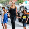 Heidi Klum et ses enfants Leni, Henry, Johan et Lou se promènent dans le quartier de Soho à New York, le 18 juillet 2014. -