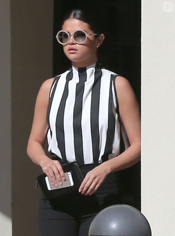Selena Gomez sort d'un building à Los Angeles, le 5 août 2014.