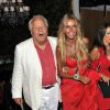 Massimo Gargia, en charmante compagnie, fête les 62 ans de Fawaz Gruosi au Billionaire. Porto Cervo, le 8 août 2014.