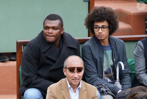 Marcel Desailly et son fils à Roland-Garros à Paris, le 28 mai 2014 lors du match entre Jo-Wilfried Tsonga et Jürgen Melzer. 