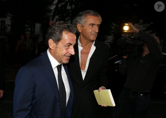 L'ex-président Nicolas Sarkozy et Carla Bruni-Sarkozy vont voir la pièce "Hôtel Europe" de Bernard-Henri Lévy au Théâtre de l'Atelier à Paris, le 12 septembre 2014.