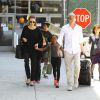 Angelina Jolie et Brad Pitt arrivent à l'aéroport de Los Angeles avec leurs enfants en provenance de Londres, le 14 juin 2014. 