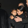 Kim Kardashian et sa fille North - Arrivée des people au défilé Balenciaga prêt-à-porter collection Printemps-Eté 2015 lors de la Fashion Week à Paris, le 24 septembre 2014. 