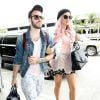 La chanteuse Kesha arrive à l'aéroport de Los Angeles avec un ami pour prendre un vol, le 30 juin 2014.