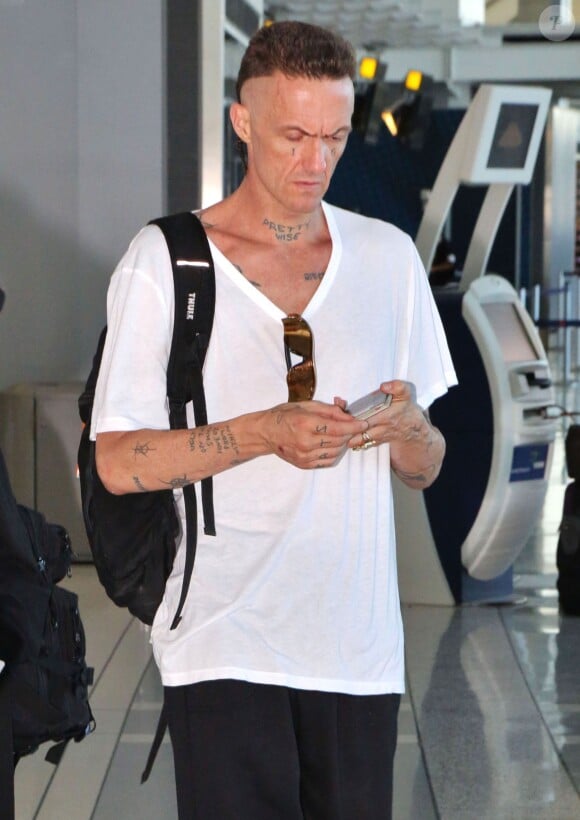 Watkin Tudor Jones, aka Ninja, du groupe Die Antwoord, à l'aéroport de Toronto pour prendre un avion, le 7 septembre 2014.