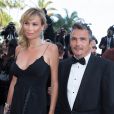 Richard Virenque et sa compagne Marie-Laure montent les marches du 67e Festival du film de Cannes, le 20 mai 2014.  Le couple a eu le 3 octobre 2014 son premier enfant, un fils prénommé Eden. 