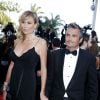 Richard Virenque et sa compagne Marie-Laure montent les marches du 67e Festival du film de Cannes, le 20 mai 2014. Le couple a eu le 3 octobre 2014 son premier enfant, un fils prénommé Eden.