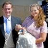 La princesse Madeleine de Suède et Christopher O'Neill avec leur fille la princesse Leonore lors de son baptême, le 8 juin 2014 à Stockholm