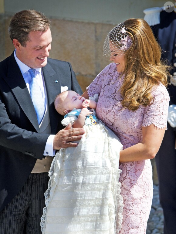 La princesse Madeleine de Suède et Christopher O'Neill avec leur fille la princesse Leonore lors de son baptême, le 8 juin 2014 à Stockholm