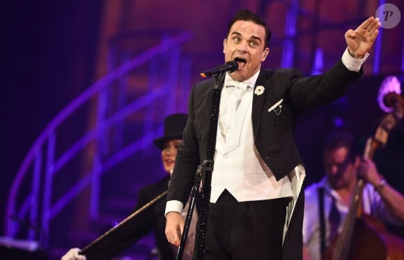 Robbie Williams en concert à Londres, le 8 juillet 2014.