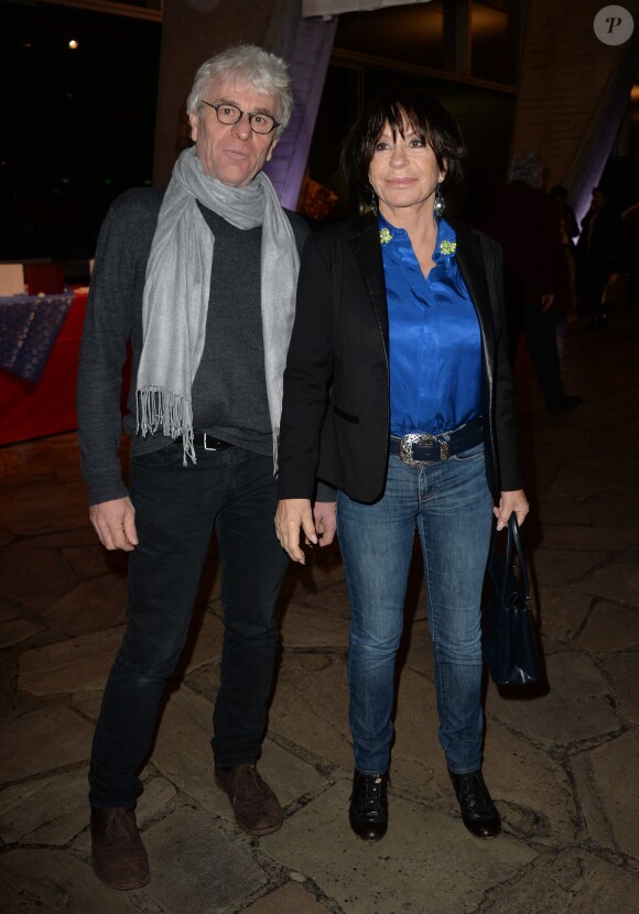 Danièle Evenou et son compagnon Jean-Pierre Baiesi assistent à la soirée du 70e anniversaire et du coup d'envoi de la campagne des Pères Noël Verts du Secours Populaire au palais de l'Unesco. Paris, le 8 décembre 2014.