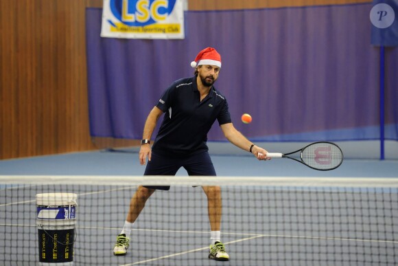 Henri Leconte lors de la journée Sourire Gagnant organisée par l'association Enfant Star et Match au Levallois Sporting Club le 18 décembre 2014