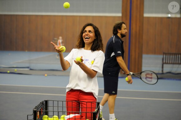 Laurence Roustandjee et Henri Leconte lors de la journée Sourire Gagnant organisée par l'association Enfant Star et Match au Levallois Sporting Club le 18 décembre 2014