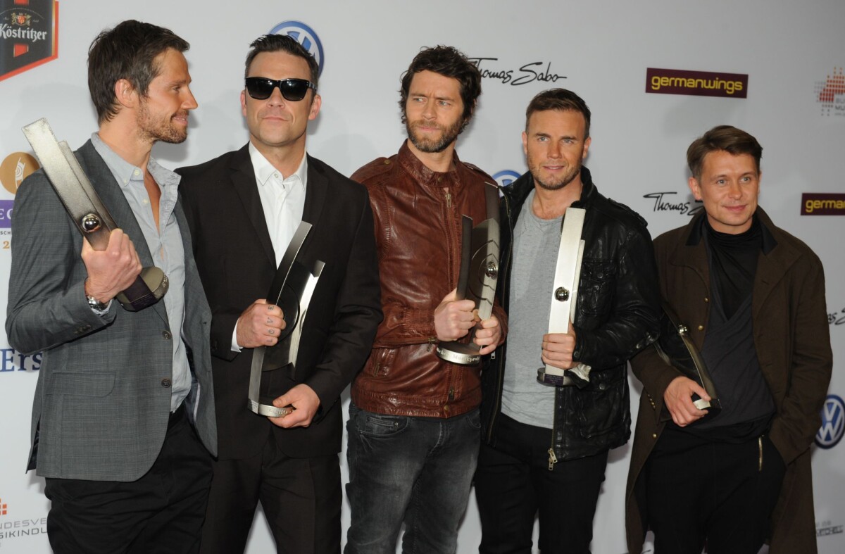 Photo Les membres du groupe Take That Jason Orange, Robbie Williams, Howard Donald, Gary
