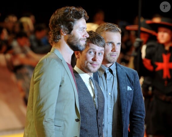 Howard Donald, Mark Owen et Gary Barlow du groupe Take That arrivent à la première mondiale du film Les Trois Mousquetaires à Londres le 4 octobre 2011  