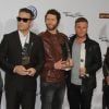 Les membres du groupe Take That : Jason Orange, Robbie Williams, Howard Donald, Gary Barlow et Mark Owen viennent de remporter un Echo Music Award dans la catégorie Meilleur groupe international le 24 mars 2011 à Berlin.